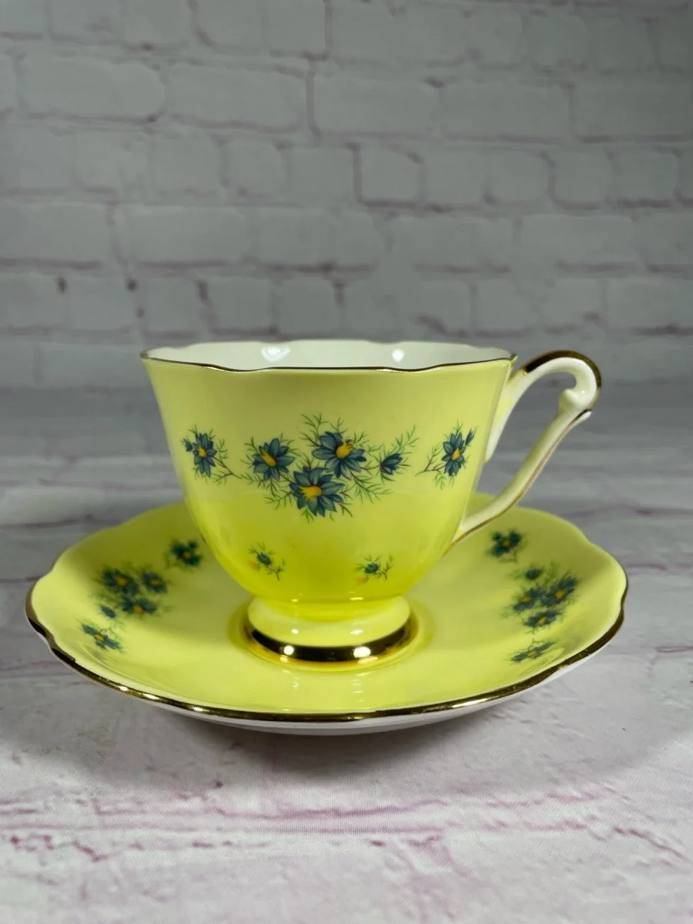 Vintage Yellow and Blue Floral Gold Trim Bone China Footed Teacup and Saucer Set